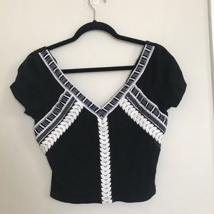 Black v-neck crop top w/ white stitching